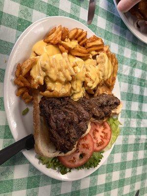 Rib eye open face with cheesy waffle fries