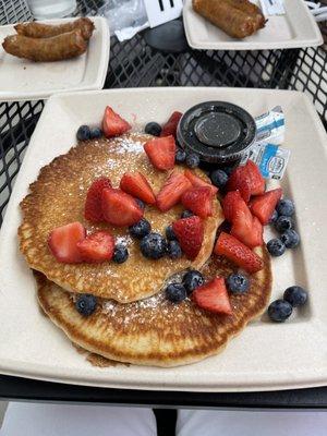 Pancakes, fresh berries, real butter and maple syrup.