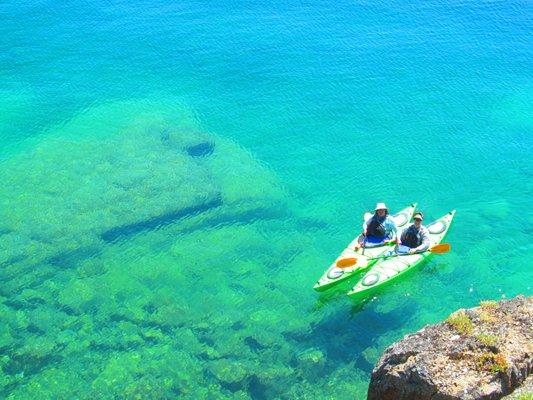 Experience the green, crystal clear water of Flathead Lake from the seat of a kayak!