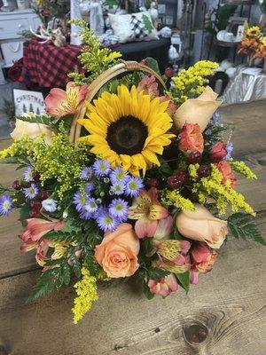 A basket full of blooms!  Baskets are easy to transport and are a great keepsake container.