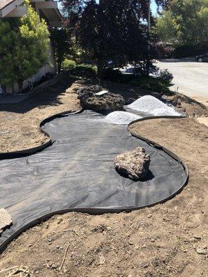 Preparing dry stream bed for gravel