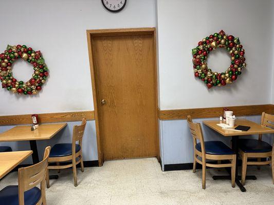 Small seating area (that door leads to eggs kitchen), but there's a long bench on the left & several 2-tops.