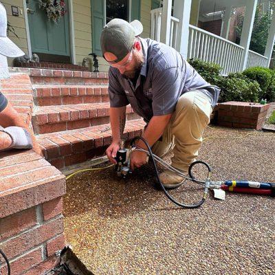 Revitalizing your home's foundation with precision! Watch our expert team at American Standard Foundation Repair in action as...