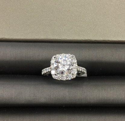 1 1/2 carat diamond with another 1/2 carat of smaller diamonds.