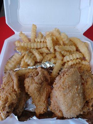 Crispy Chicken Wings & Seasoned Fries.