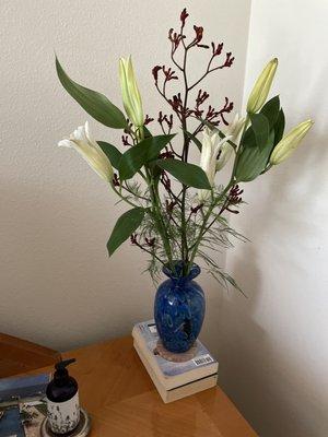 White lilies with exotic protea