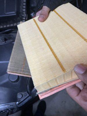 A new air filter compared to my car's air filter (after being tapped against the wall)