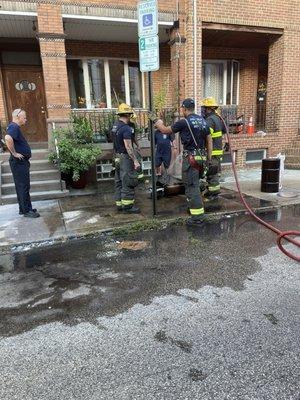 Fireman making sure my scooter is out after the fire