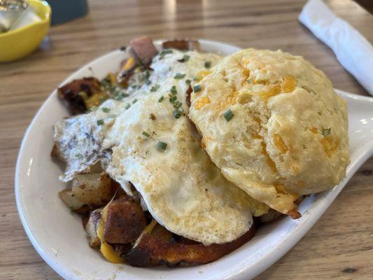 Bacon and ham and cheese and potatoes with eggs and a biscuit YUM