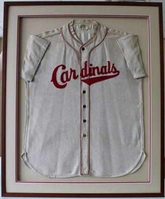 Our customer's father played for the St. Louis Cardinals in 1942. after 70 years in a box, he decided to have his Jersey framed