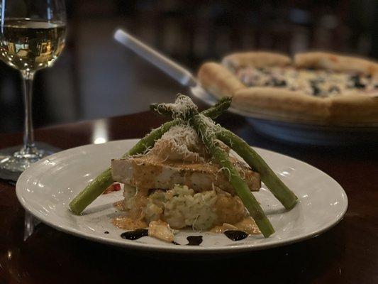 This was a special of the day, it's swordfish over risotto with seafood imperial on top and asparagus.