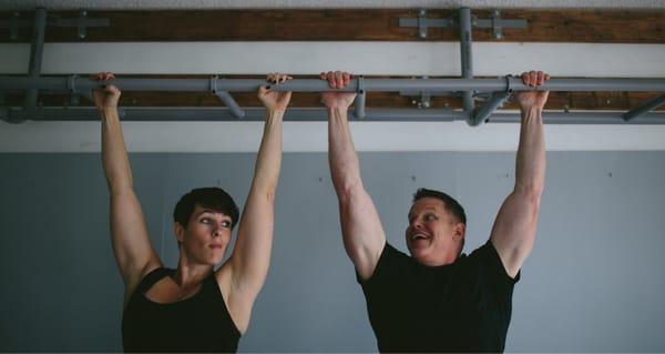 Hanging with my homey. Hanging from a bar helps with shoulder health. Arms that don't go overhead won't go overhead.