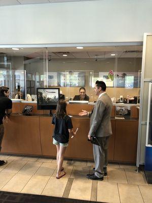 Relationship manager Jose Cabrera working to help my daughter with her first deposit.