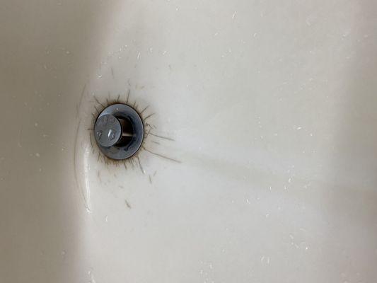 Old outdated and grimy sink that didn't drain.