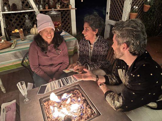 Franki and Greeshma laughing with a querent.