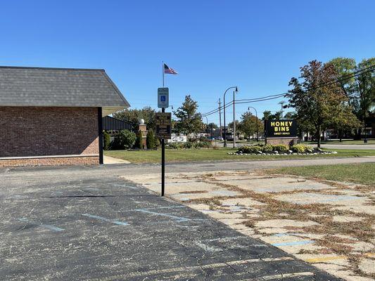 The parking lot and sign out front.