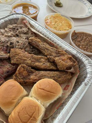 Fried Ribs, Grilled Ribs, pulled pork, Mac and cheese and baked beans. Top right is the BBQ SAUCE that SLAPS!