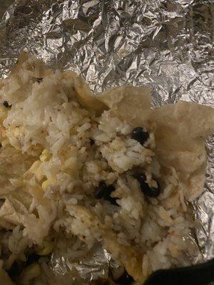 That's the burrito opened...plain boiled rice and 2 corn kernels.