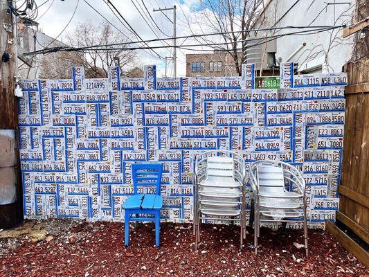 The Illinois Plate wall was made with plates from the former used car lot next door.