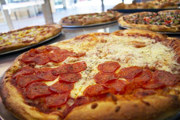 Come visit our pizza counter for a slice or two!