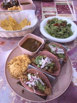 Chicken Tacos, rice and beans, chips and salsa, fresh guacamole