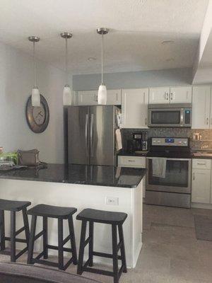 Beautiful white cabinets with soft close feature and pull out drawers on base cabinets. Love them!