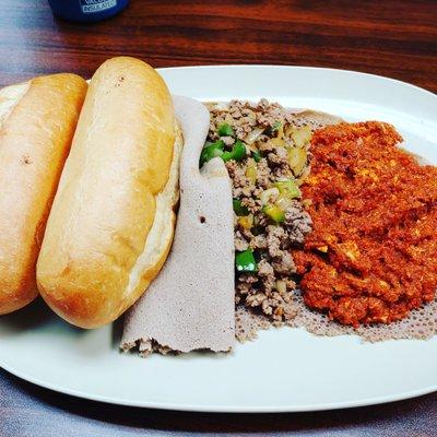 Bukri's special breakfast.  Kitfo Dulet and Egg Firfir.  #ethiopianfood #ethiopianbreakfast