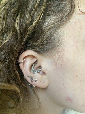 Pictured is my lovely healed daith piercing with new jewelry :)