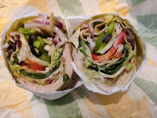 Inside of the Turkey, Bacon, Guacamole Spinach Wrap... With ranch dressing and All veggies, except jalapeno