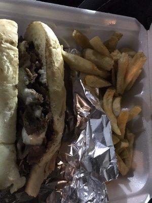 Philly cheese steak sandwich w/ side of fries