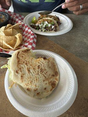 Gorila de harina with picadillo and in the back are barbacoa tacos