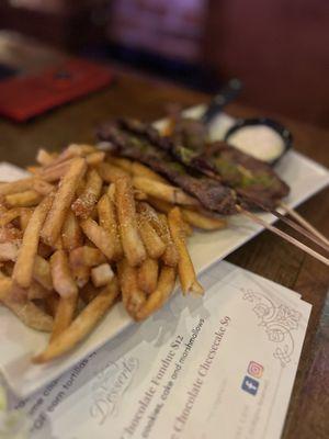 The meat skewers and Parmesan fries