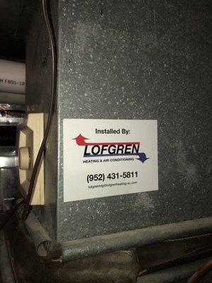 Sticker on furnace stating installed by Lofgren