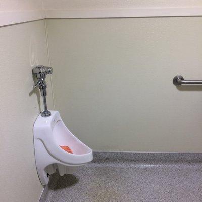 Has a urinal as well. Great for keeping the toilet seat clean.