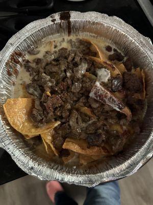 Sloppy soggy wet 8 tortilla chips Steak Super Nachos