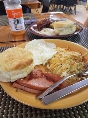 Fried bologna (Yum), eggs, hash browns, and a big delicious biscuit.