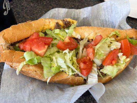 Cheesesteak with grilled onions, peppers and cheese whiz. I also added lettuce and tomato.