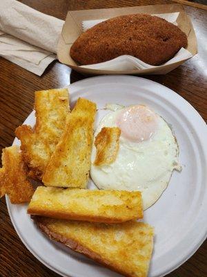 Devil Crab and an over easy egg for the perfect Tampa breakfast.