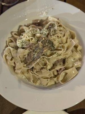 Handmade Fettucine with Alfredo, prosciutto and mushrooms