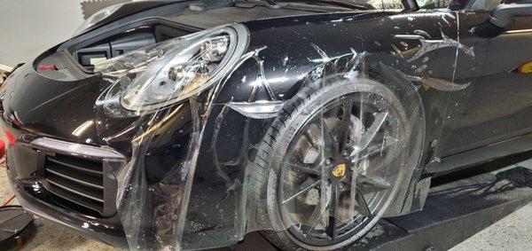 This is a photo of the custom fender protection being installed on the Porsche 911!