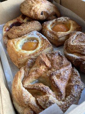 Chocolate croissant, raspberry and apricot pastry, and kouign amann