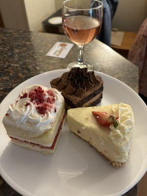 White cake with raspberry filling,chocolate cake and cheesecake.