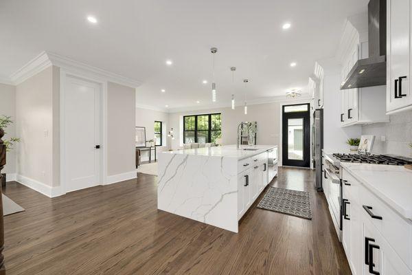 42" white Shaker with Crown and beautiful island with waterfall quartz countertop