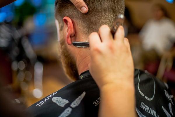 Cleaning up neckline with straight razor