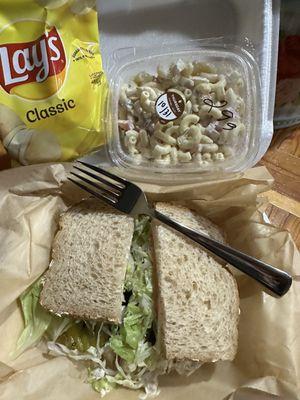 Tuna salad sandwich, macaroni salad and chips