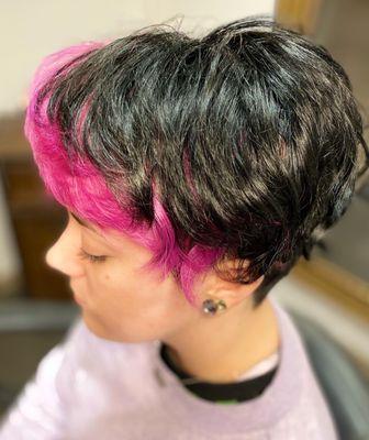 Bright pink fringe under black Mohawk