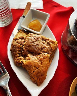 My homemade pumpkin scone served warm with a dollop of lemon curd! Yummy