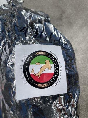 Their logo wrapped on their sandwich.