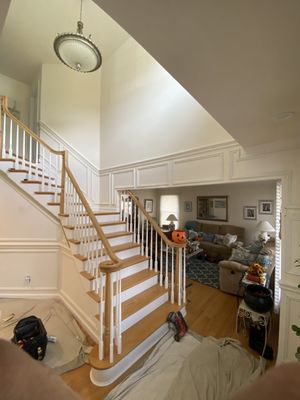 Chair rail and applied panel molding installed for this customer going up the stairs and around the first floor foyer