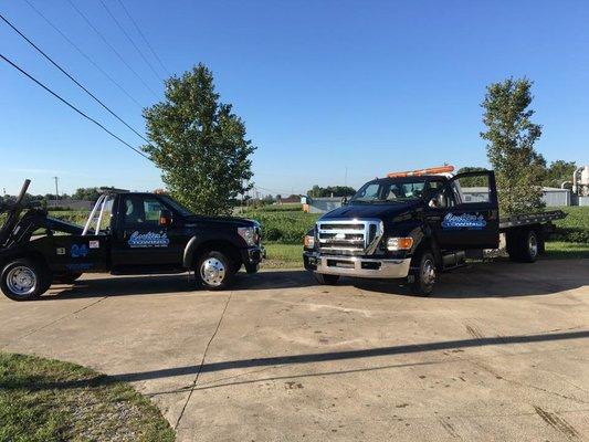 Two of our 7 trucks! 4 rollbacks and 3 wreckers.